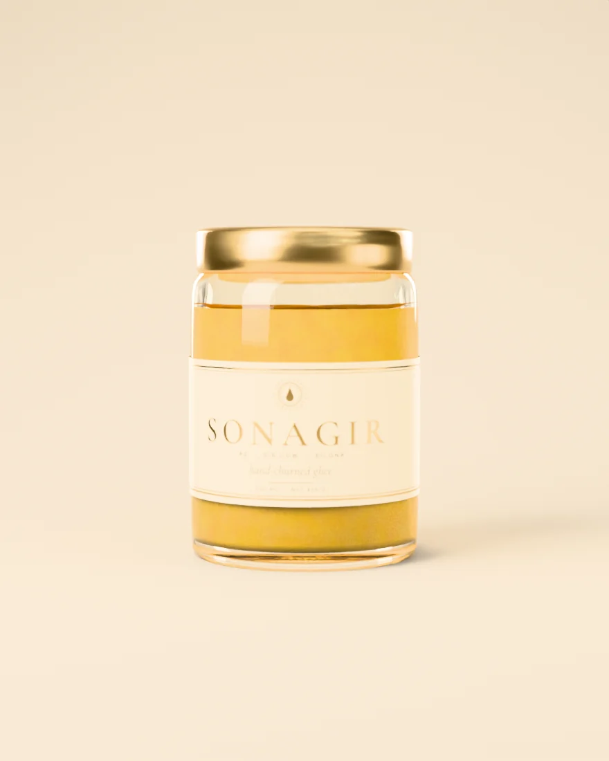 A jar of Sonagir A2 Gir cow ghee with a gold lid